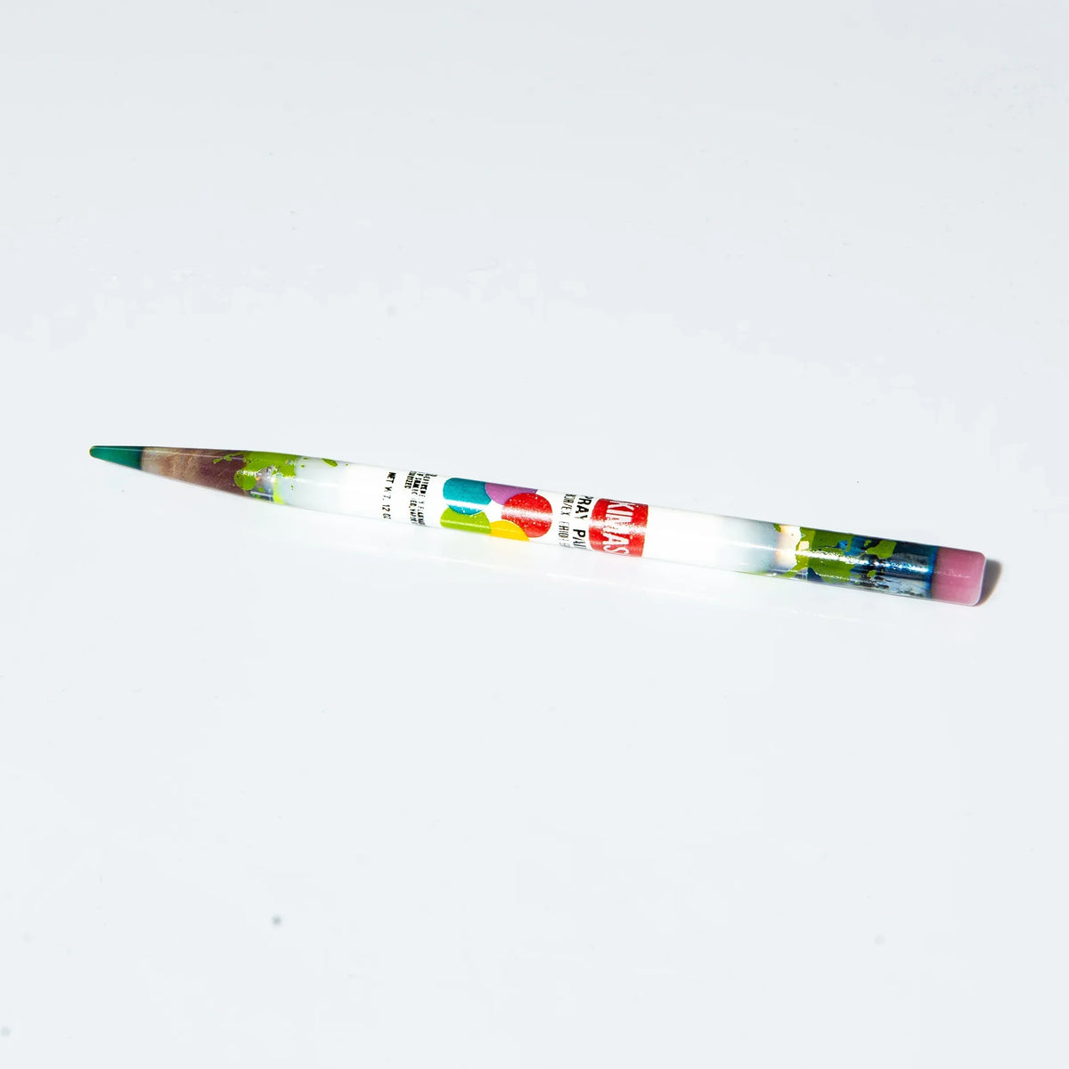 Handcrafted glass pencil with colorful design accents on a white background.