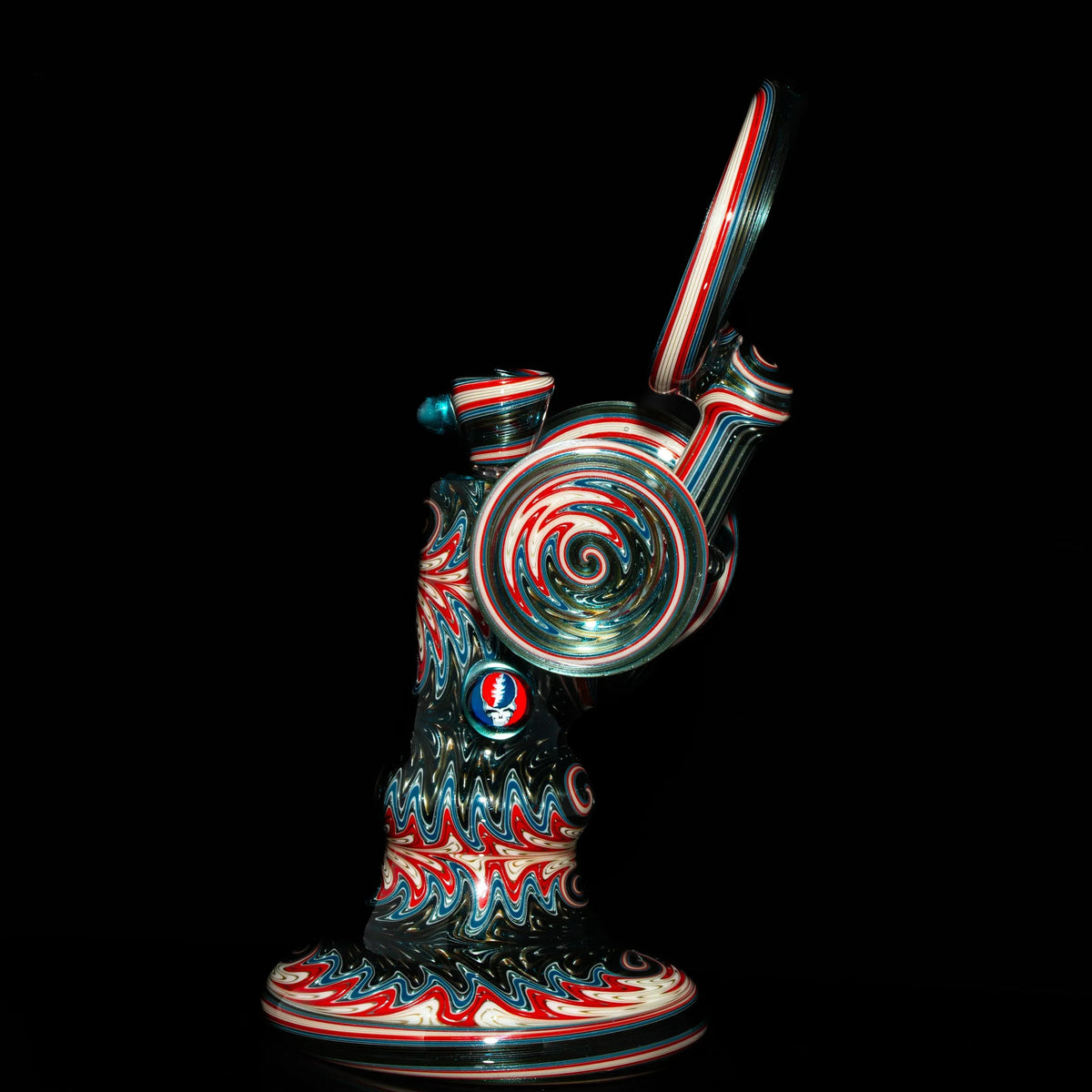 Heady glass water pipe with intricate red, blue, and white swirl patterns on black background