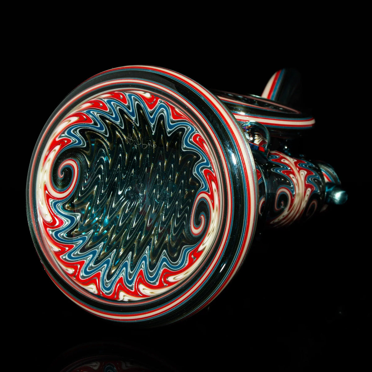 Heady glass pipe with intricate red, blue, and white swirl patterns on black background