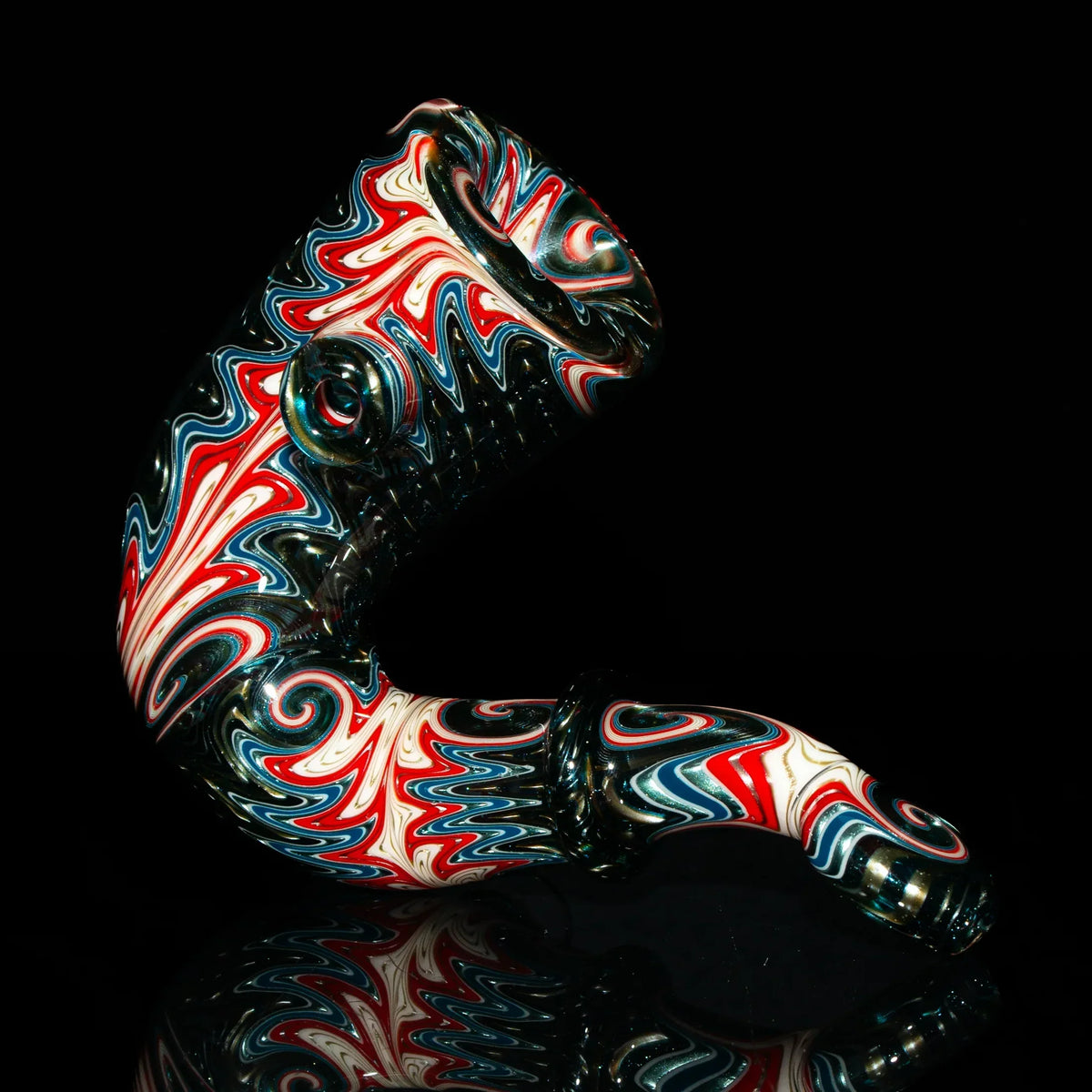 Heady glass pipe with vibrant red, white, and blue swirl designs, displayed on black background