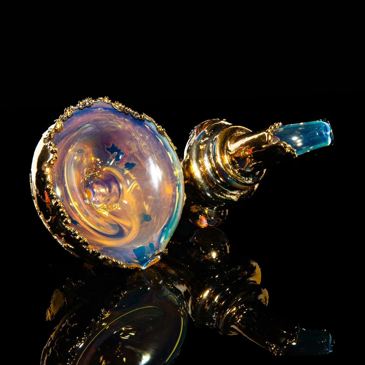 Handcrafted gold-accented glass Sherlock pipe with iridescent swirl design on black background