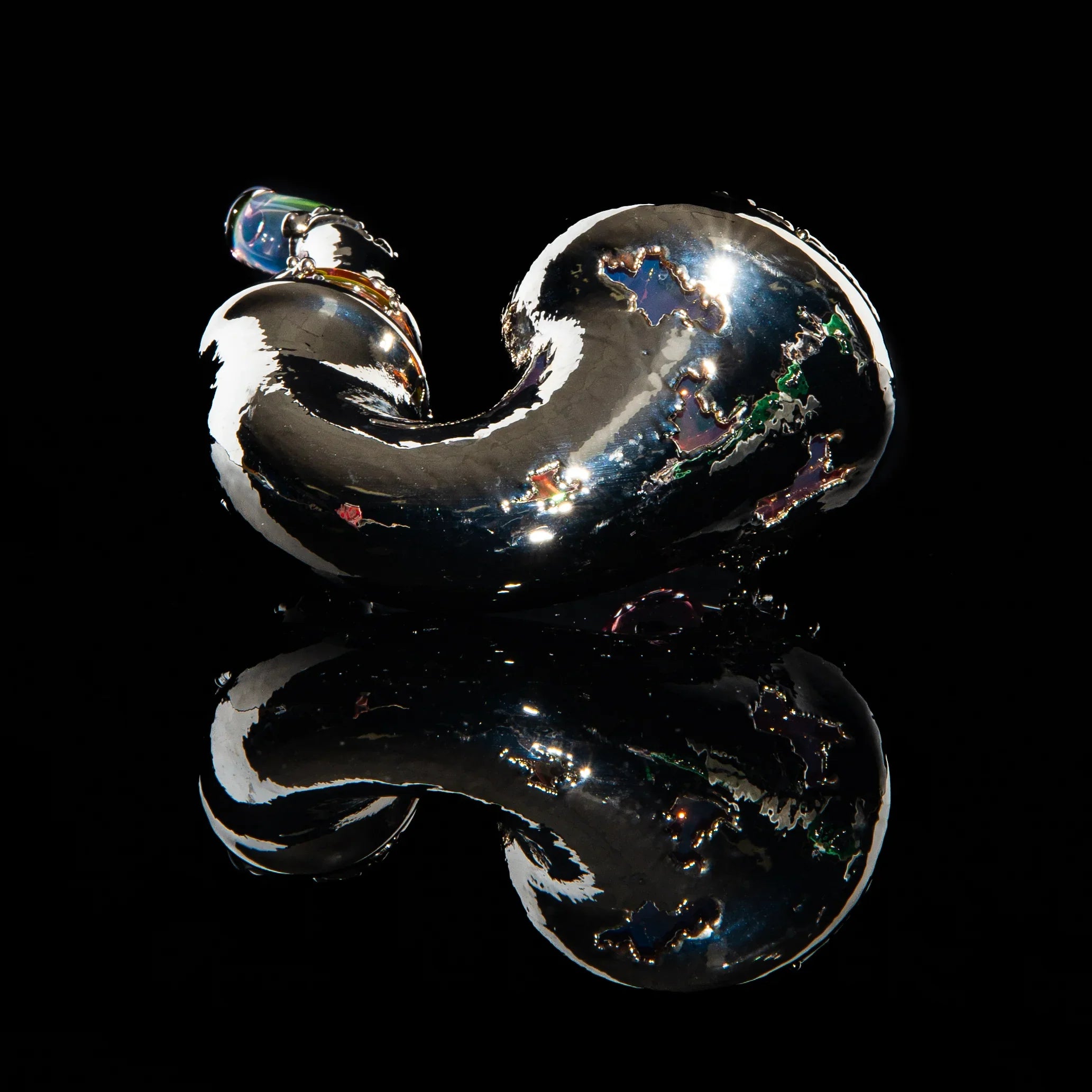 Nickel finish sherlock glass pipe with iridescent accents on black background