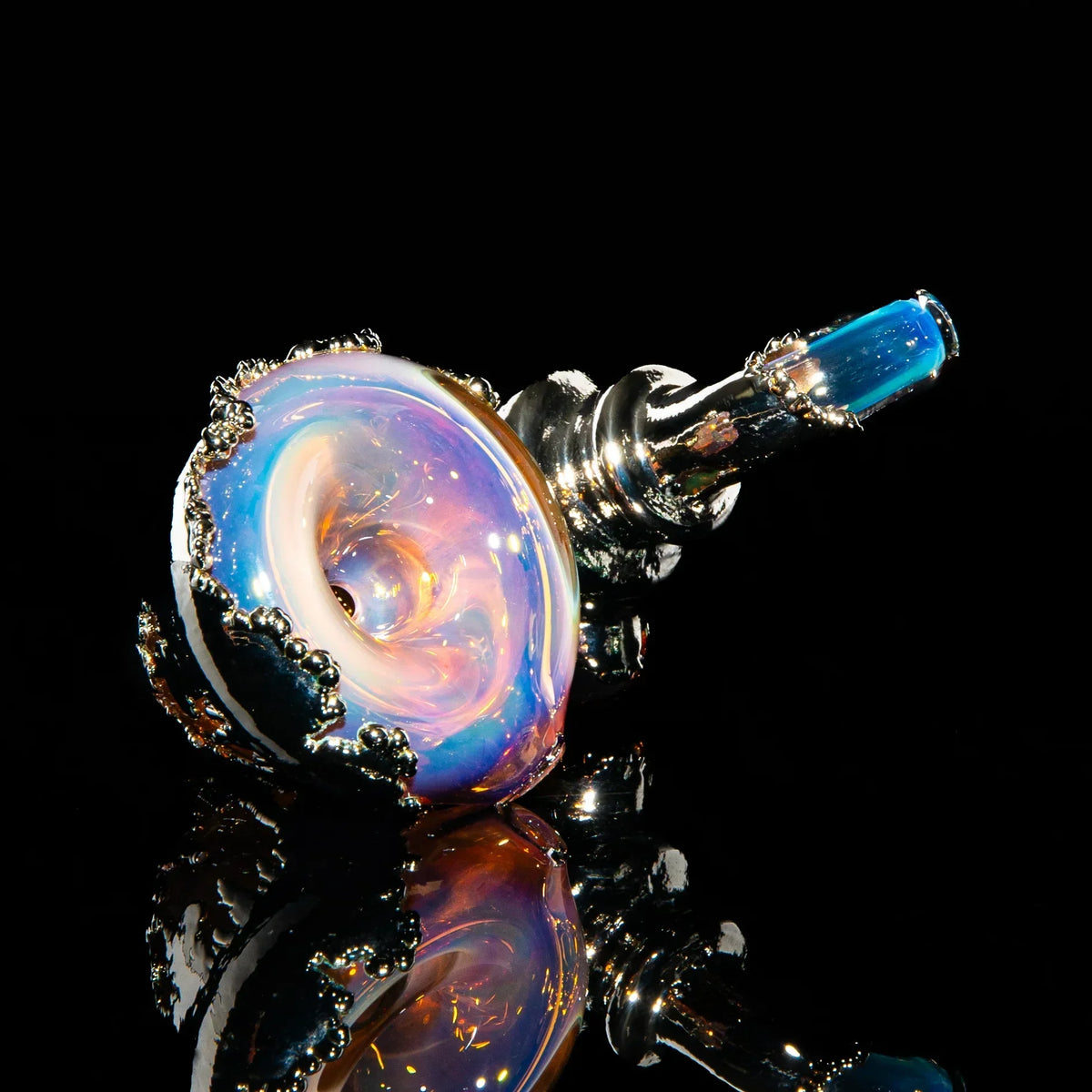 Iridescent borosilicate glass sherlock pipe with metallic accents on a black background