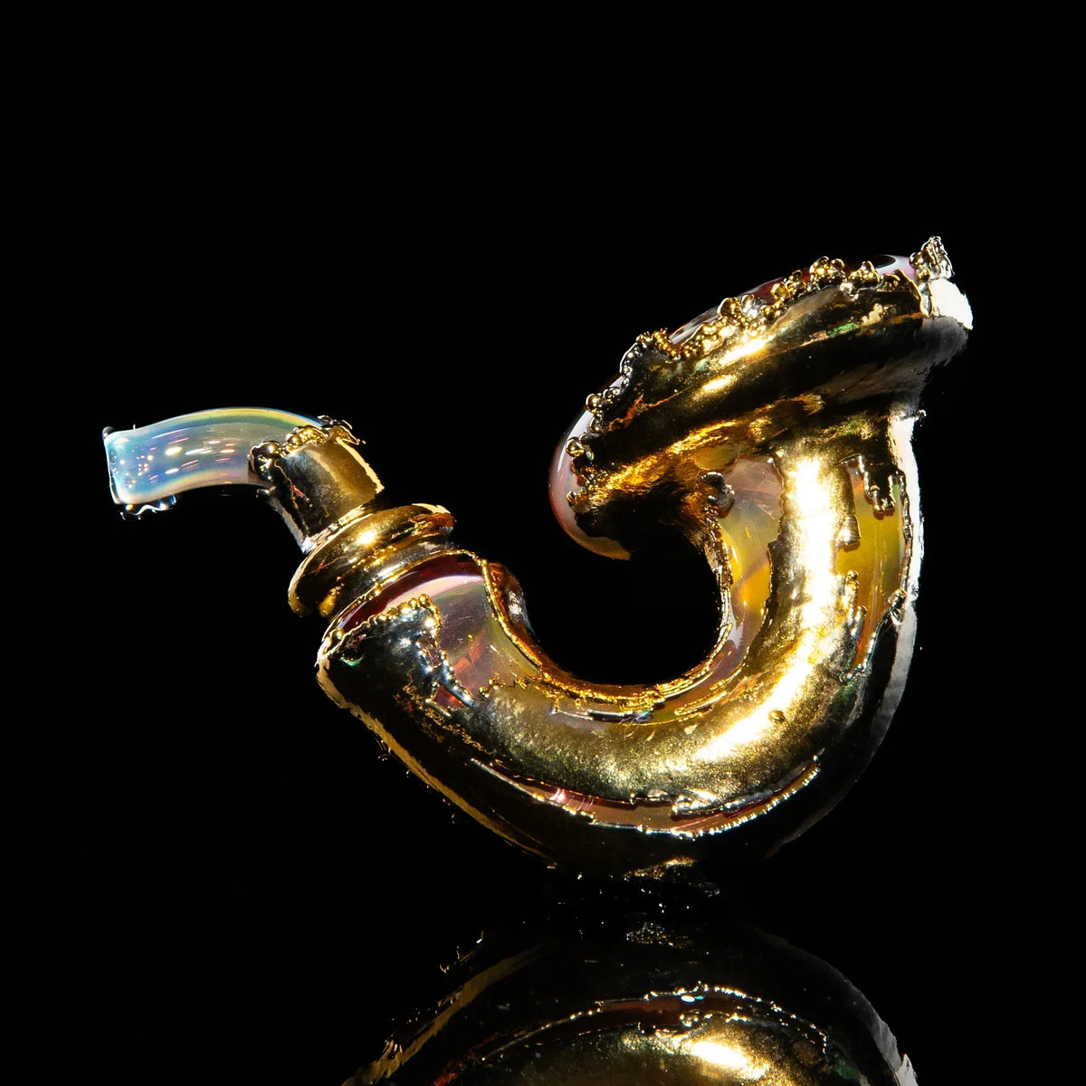 Gold Sherlock glass pipe with iridescent mouthpiece on black background