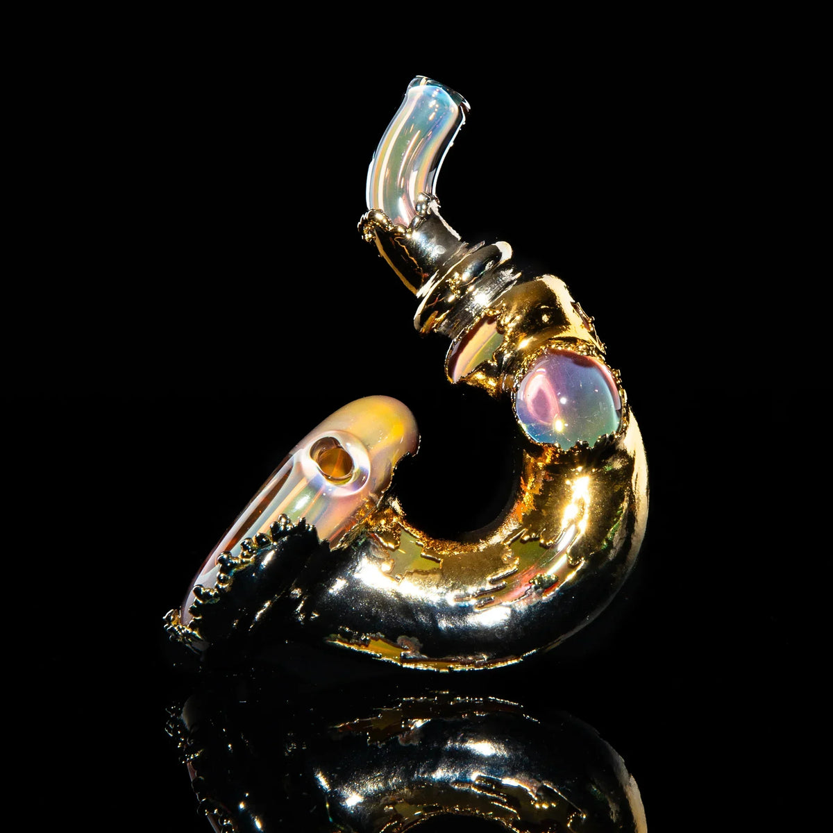 Handcrafted gold glass Sherlock pipe with iridescent accents on black background