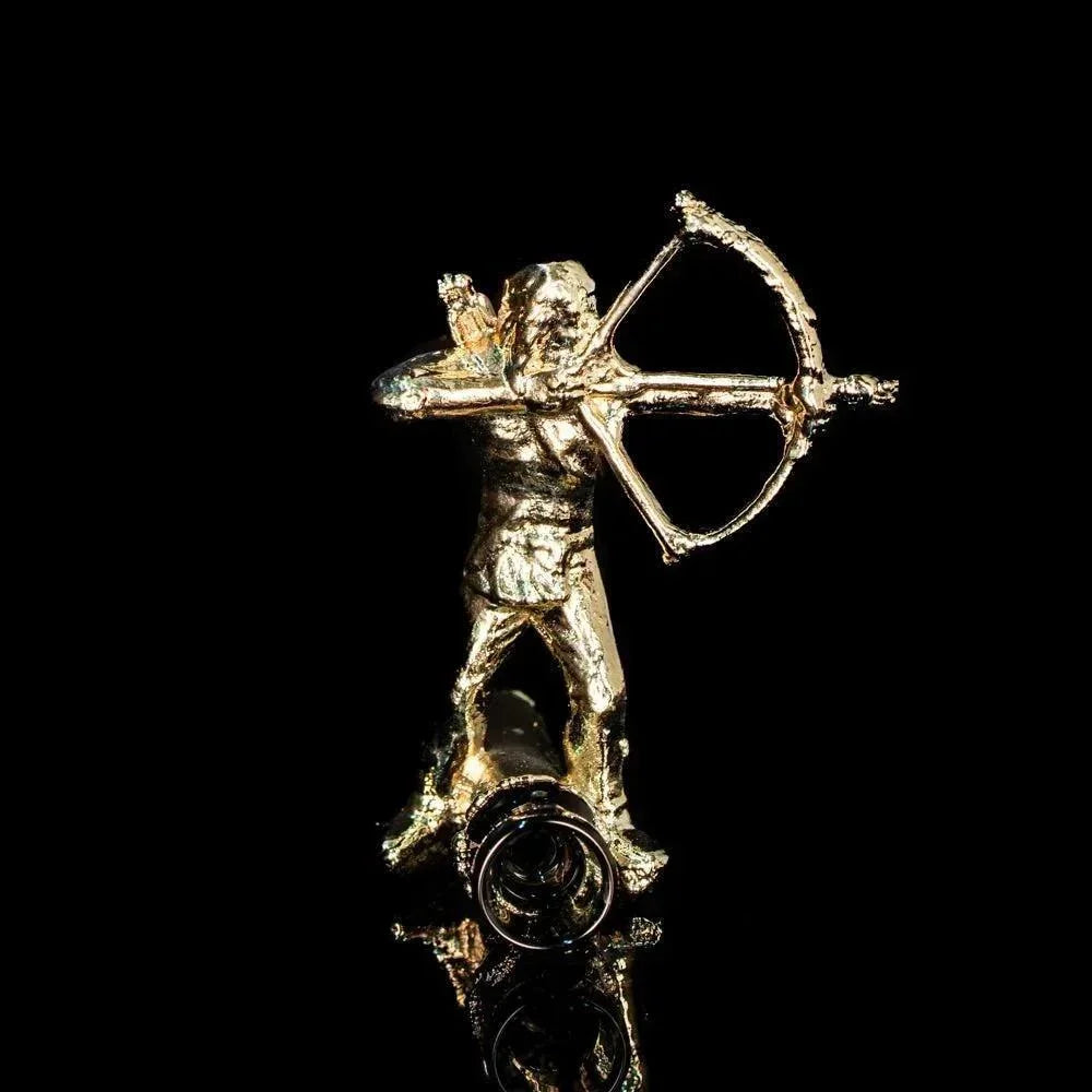 Gold archer figurine glass pipe on black background, handcrafted smoking accessory