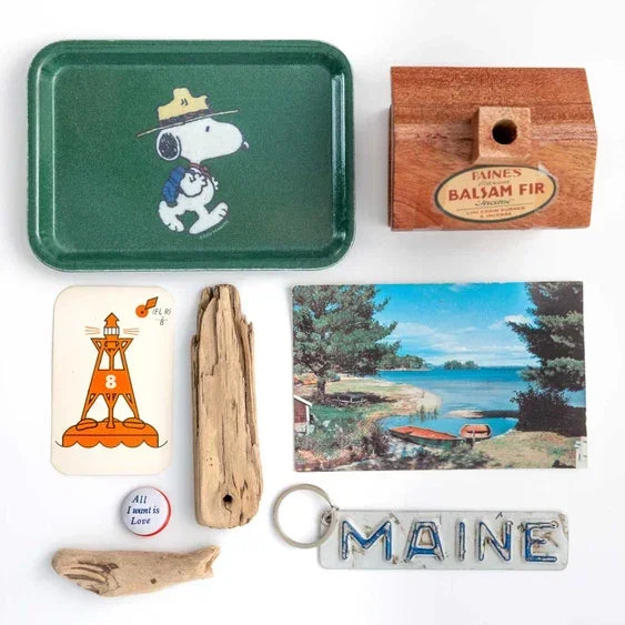 Vintage green Snoopy Beagle Scout tray with Maine souvenirs and rustic memorabilia collection.