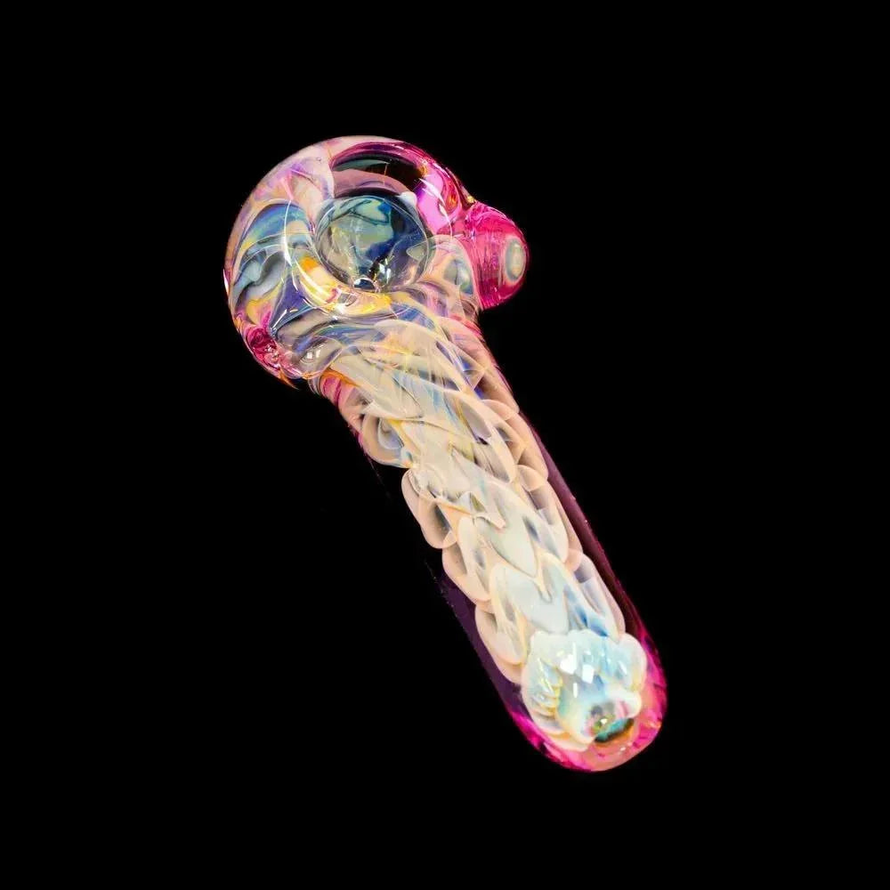 Pink inside-out glass spoon pipe with intricate swirling patterns on a black background