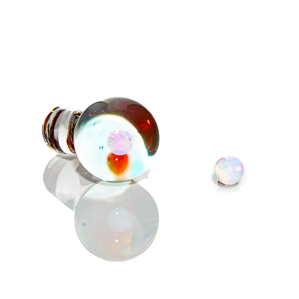 Handblown amber purple opal glass carb cap and pearl on white background