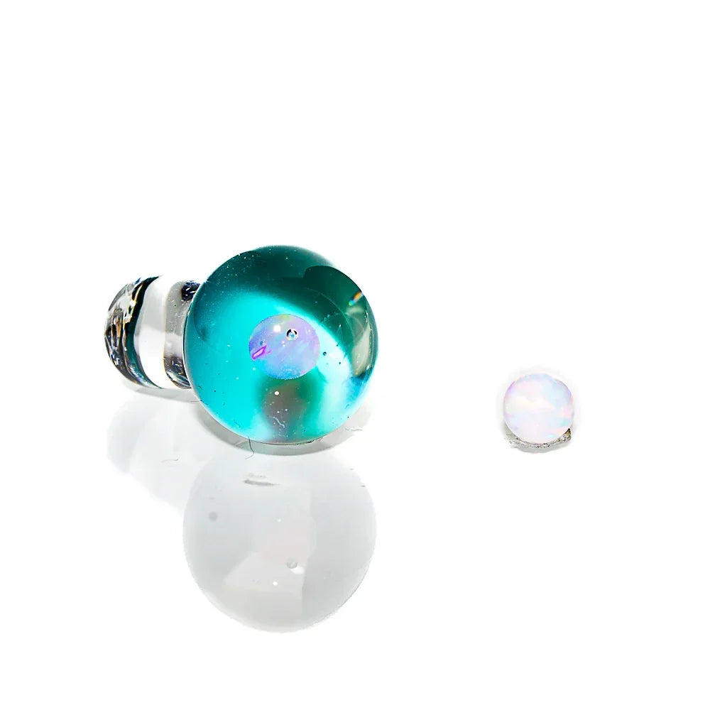 Teal opal glass sphere carb cap and opal pearl on white background