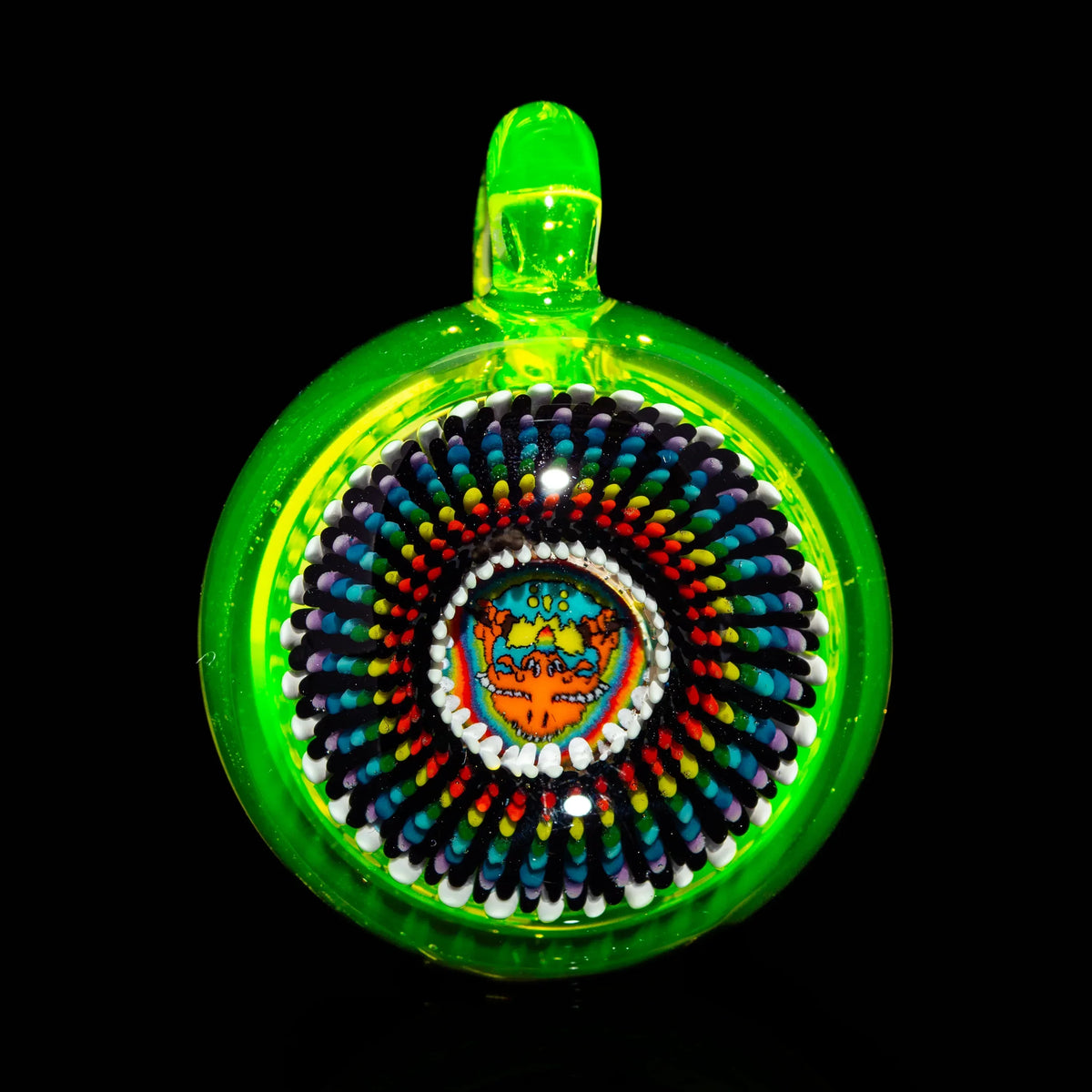 Handblown glass pendant with bright neon green rim and intricate psychedelic pattern