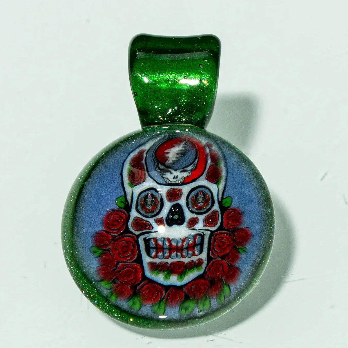 Glass pendant with skull and roses design, green glitter bail, handcrafted art jewelry