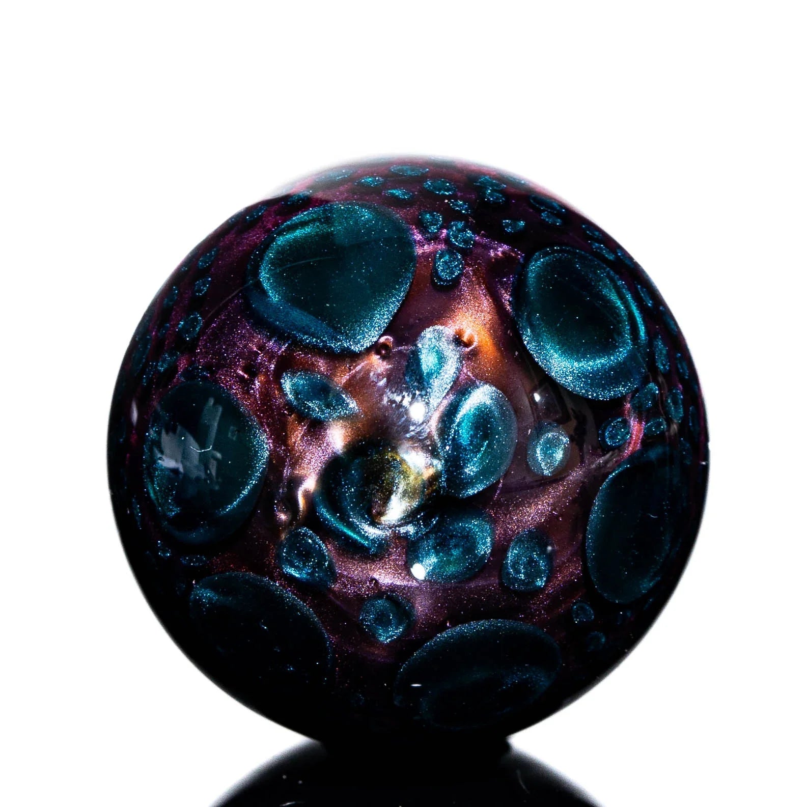 Handcrafted glass marble with iridescent purple and blue textures, vaporizer accessory
