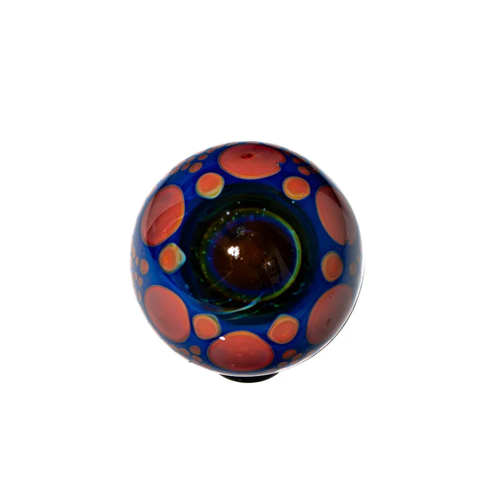 Hand-blown glass marble with blue base and orange bubble patterns, art glass accessory