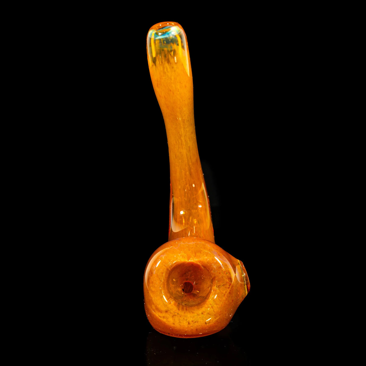 Orange blown glass sherlock pipe with inside-out frit design on black background