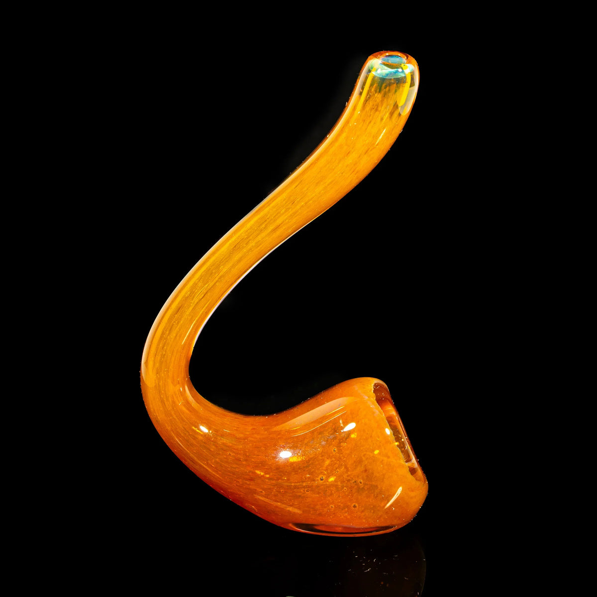 Orange glass Sherlock pipe with inside-out frit design on a black background
