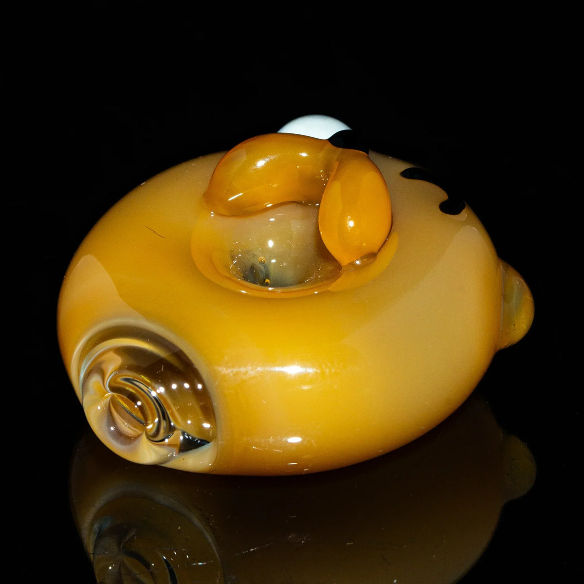 Handcrafted yellow glass joint holder shaped like a cartoon dog head, glossy finish