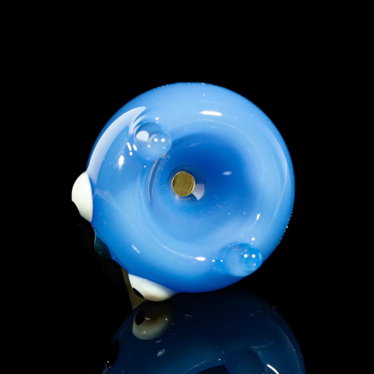 Milky blue 14mm glass bowl slide with whimsical character design on black background