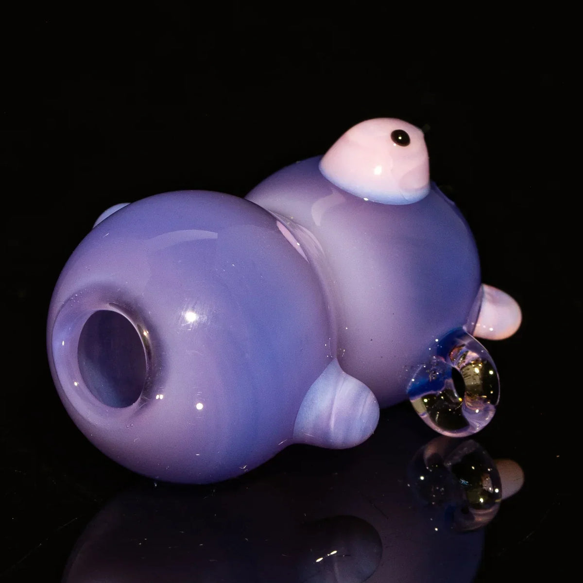 Purple glass bear-shaped joint holder accessory on black background