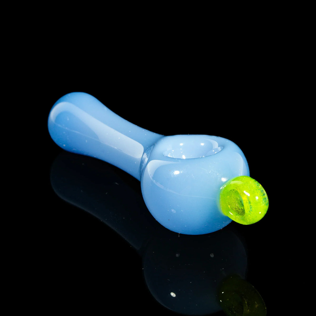 Milky blue glass pipe with neon green marble accent on black background