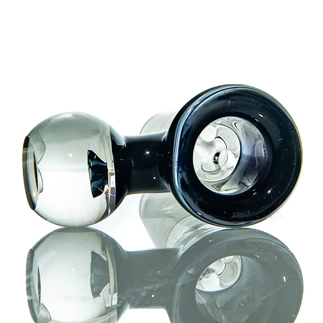 Hand-blown glass pipe with a clear bowl and reflective surface for smoking accessories.
