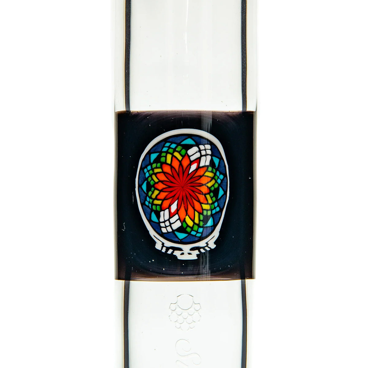 Close-up of a glass water pipe with vibrant stained glass-style flower design