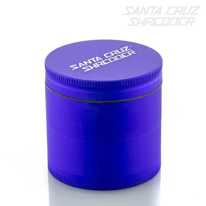Purple Santa Cruz Shredder herb grinder with logo on lid, isolated on white background.