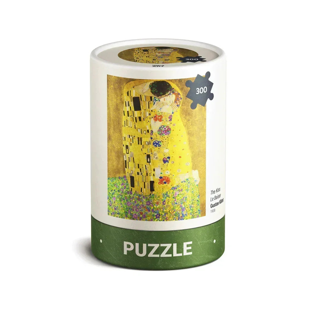 Cylindrical box of a 300-piece puzzle featuring Gustav Klimt's The Kiss artwork.