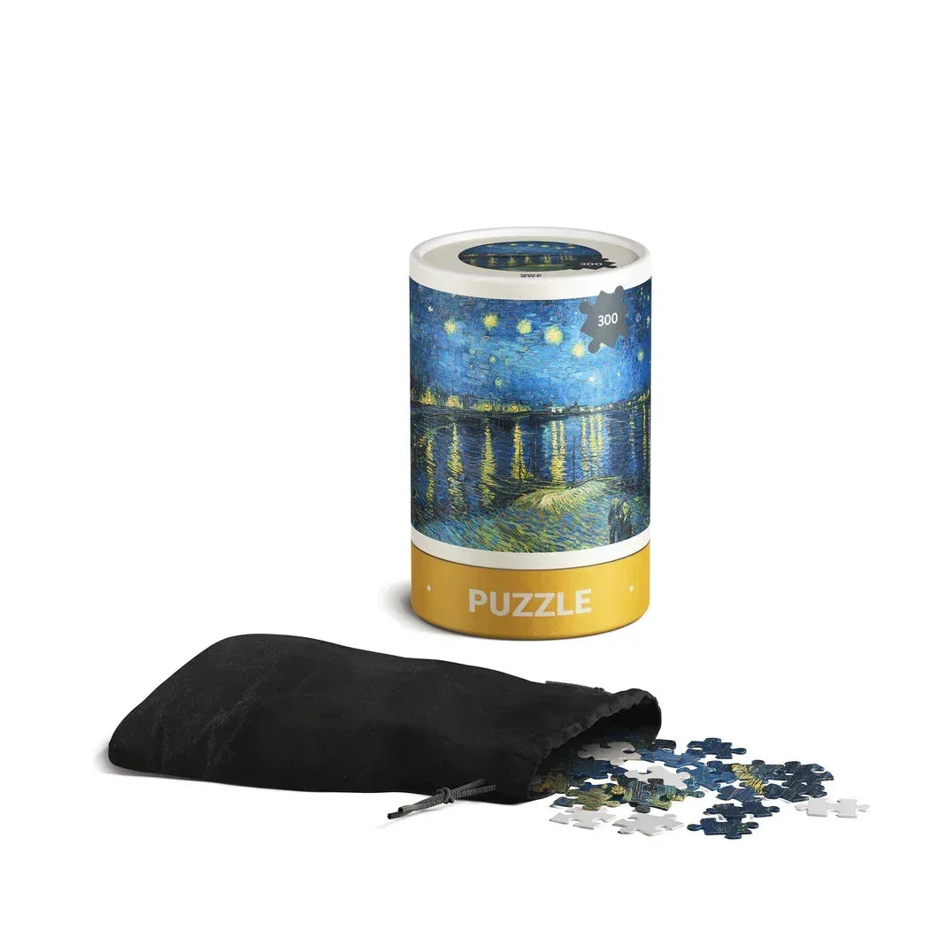 Starry Night jigsaw puzzle in cylindrical box with black pouch and loose pieces