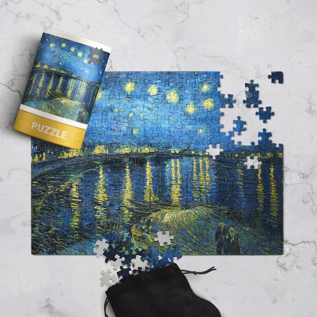 Starry Night themed 300-piece jigsaw puzzle partially completed on marble surface