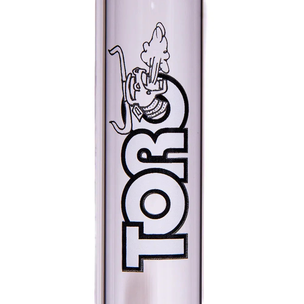 Close-up of clear glass tube with Toro logo and smoked-out character illustration.