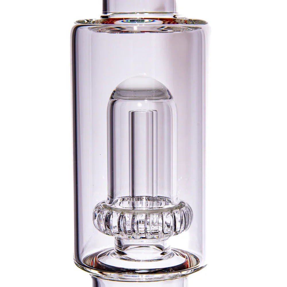 Clear glass water pipe chamber with intricate percolator detail, close-up view