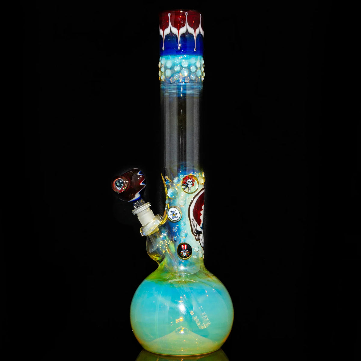 Fumed glass bong with colorful accents and detailed art on black background