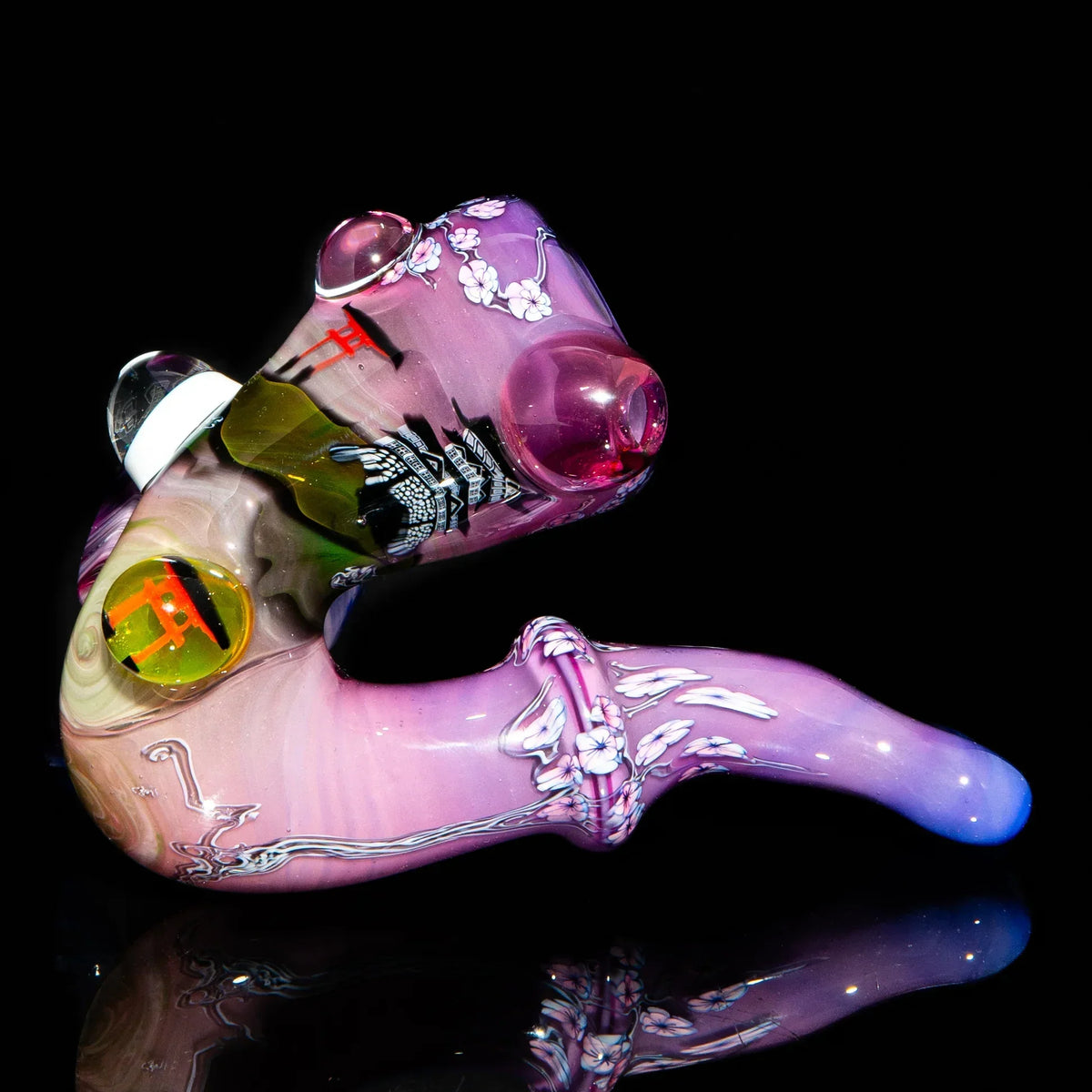 Colorful heady glass pipe with cherry blossom and Japanese-inspired designs on black background