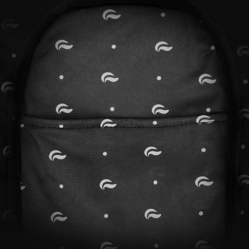 Black backpack with white abstract pattern and front pocket, close-up view