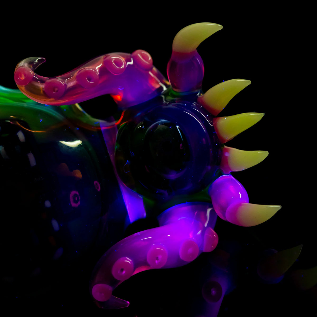 Colorful glass slide with tentacle and horn accents, vibrant heady glass accessory