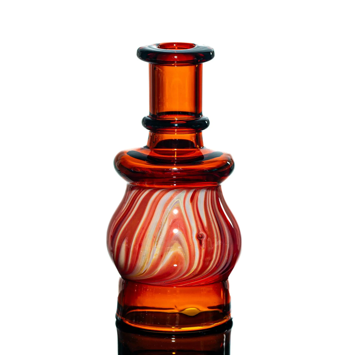 Handblown red glass water pipe with swirled white and orange accents on white background