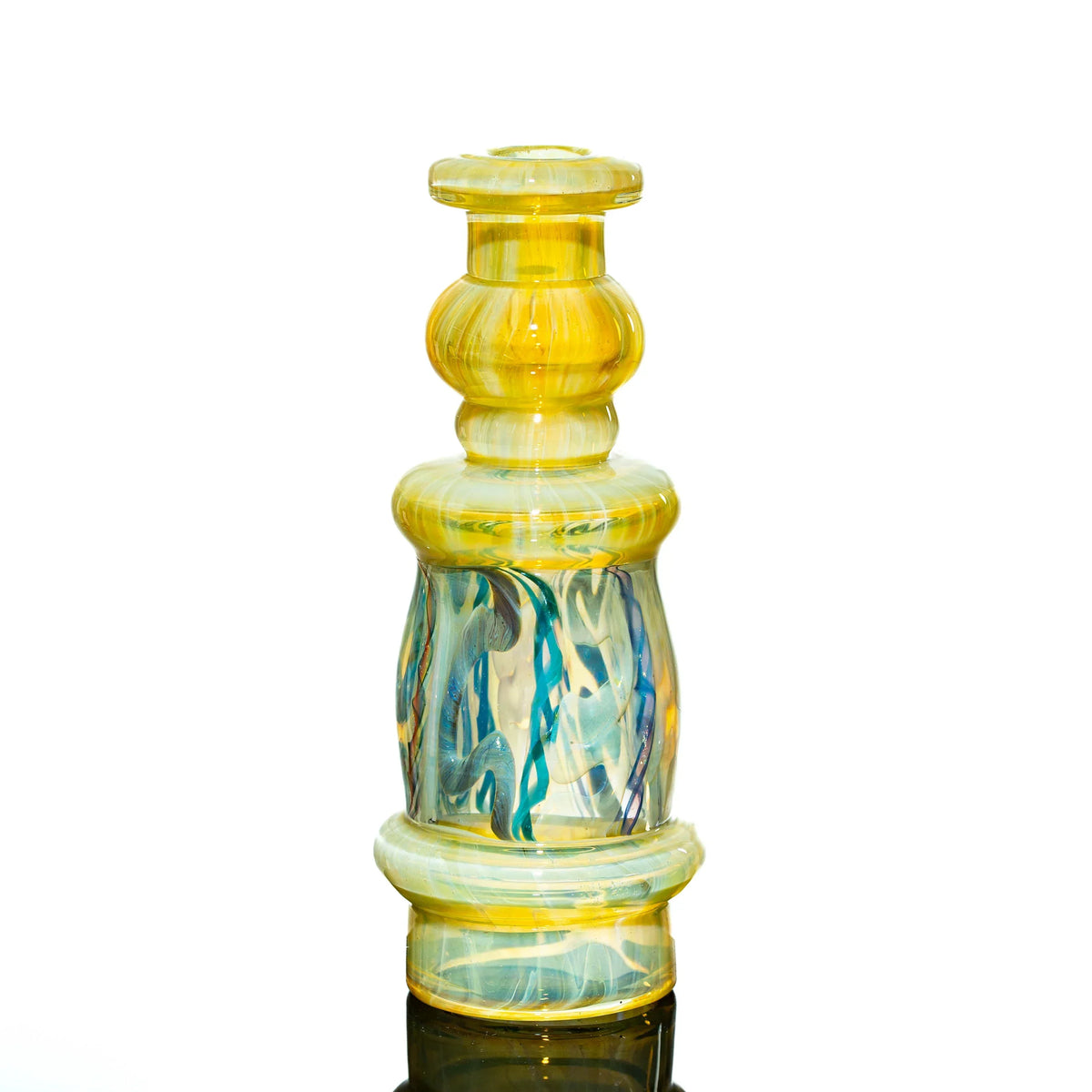 Handblown glass water pipe with yellow and blue swirled patterns on white background