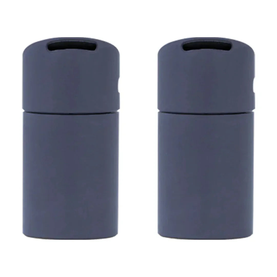 Two black silicone storage containers for smoking accessories on a white background