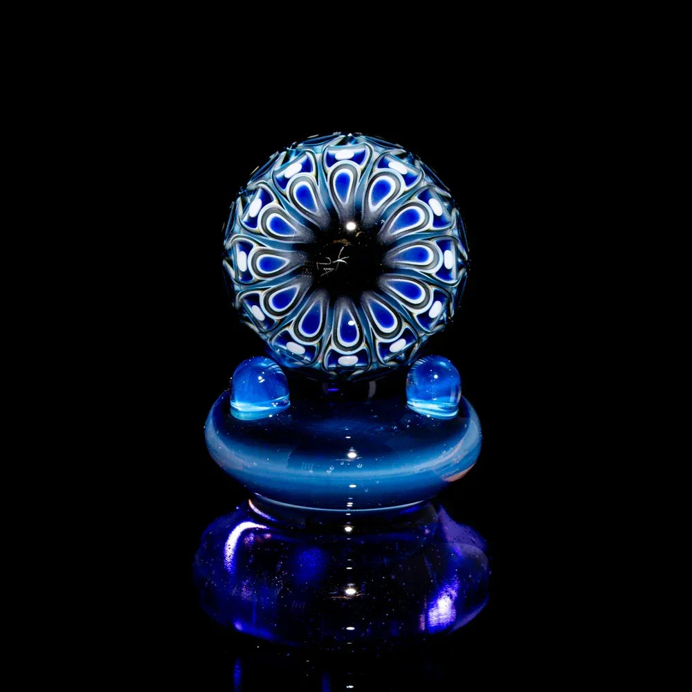 Handcrafted blue and black glass marble with intricate pattern, art glass accessory