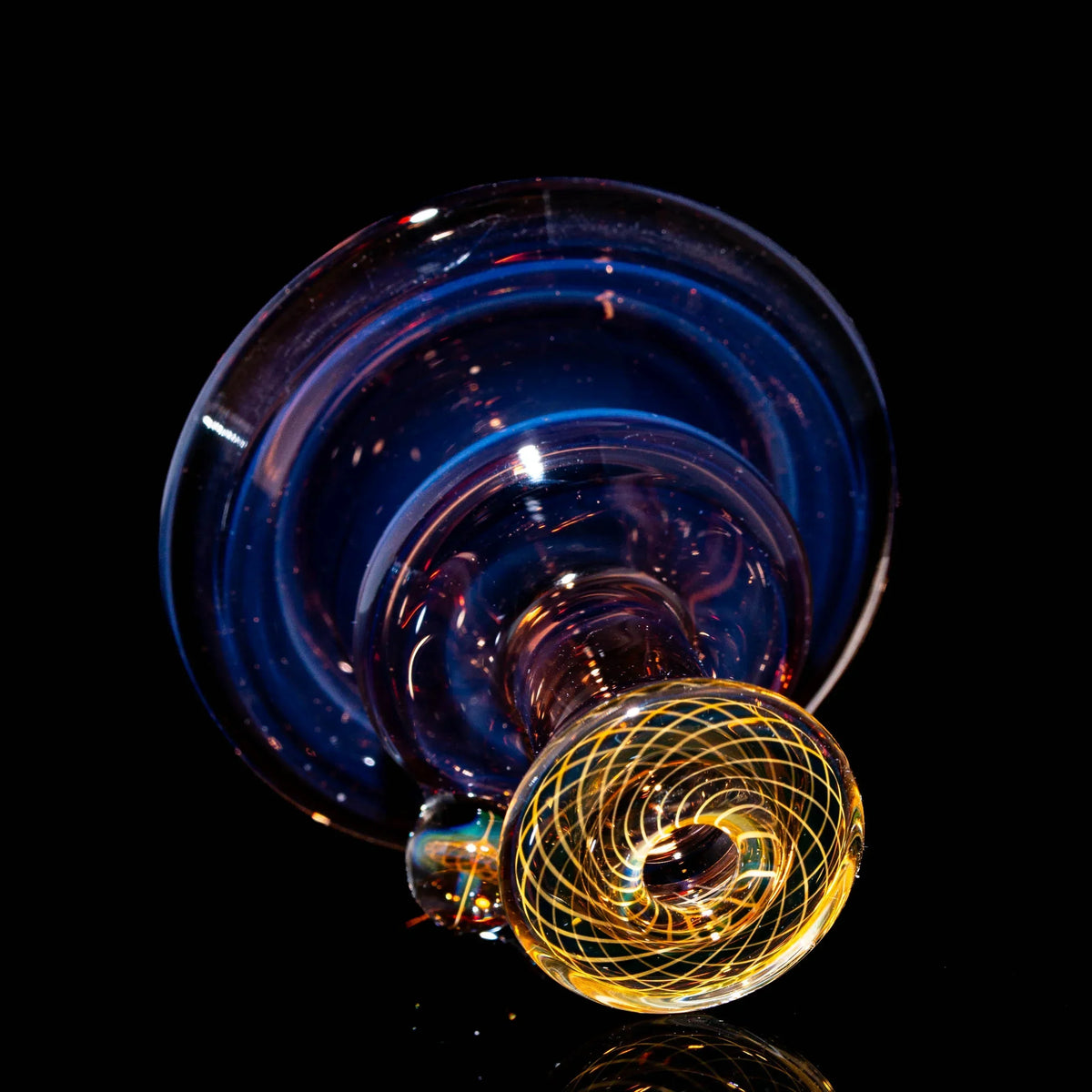 Hand-blown glass attachment with opal and intricate yellow fumicello pattern on black background