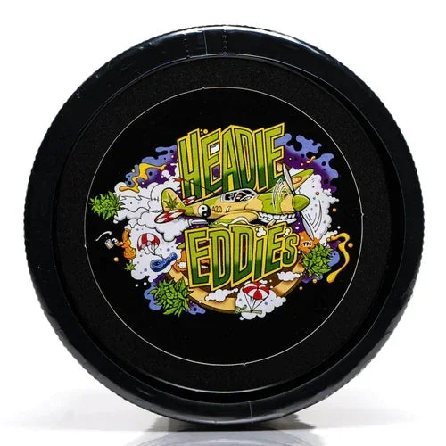 Round black container lid featuring colorful 'Heady Eddies' graphic with smoke and art elements