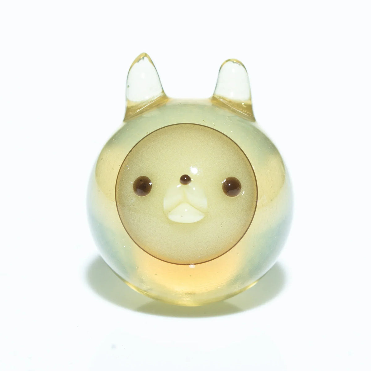 Round glass carb cap shaped like a cute animal with ears on a white background