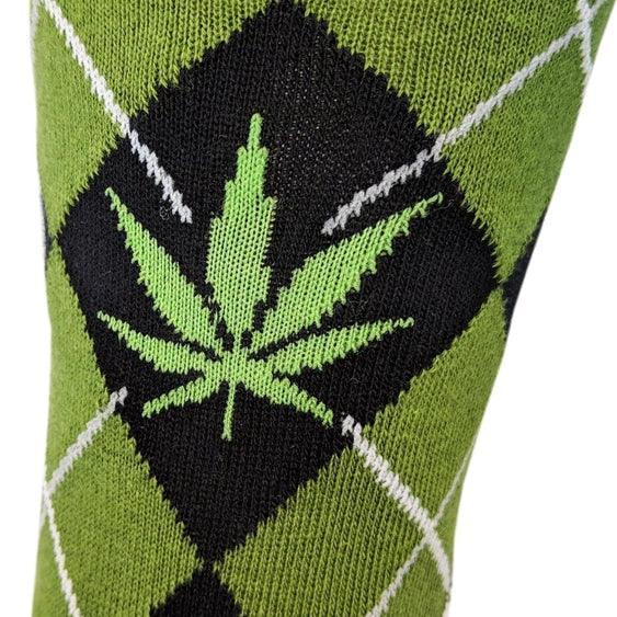Green and black argyle sock with a cannabis leaf design