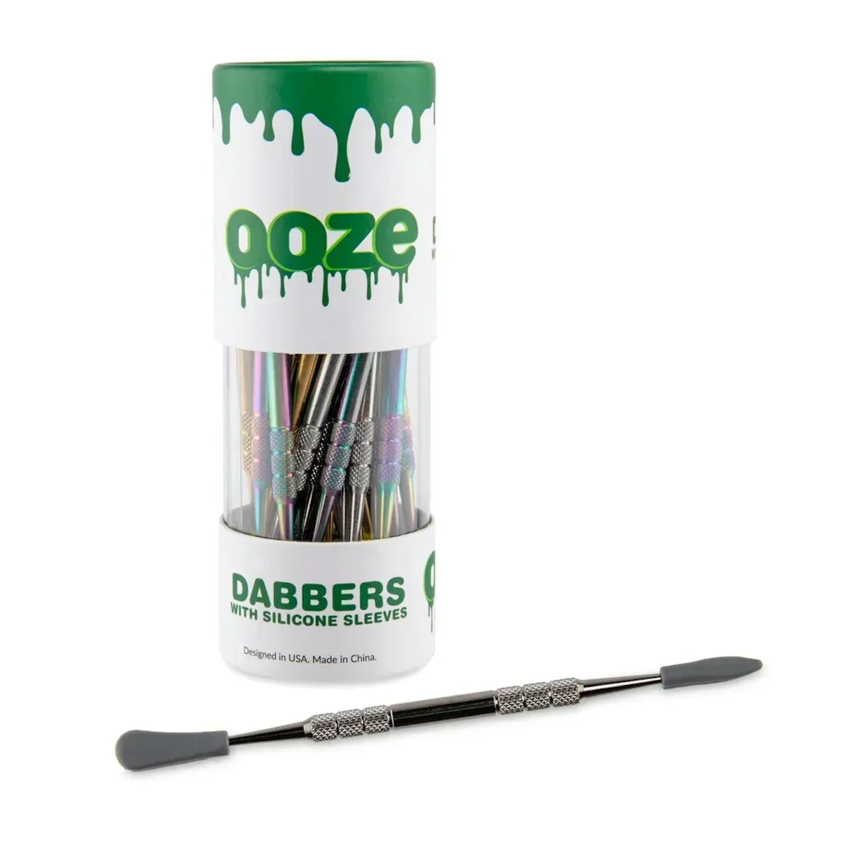 Ooze dabbers with silicone sleeves in a display container, rainbow metal tool shown