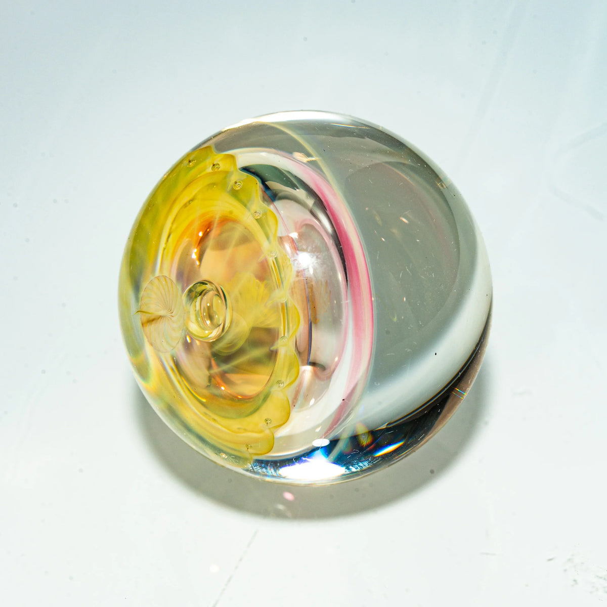 Hand-blown glass marble with yellow and pink accents, heady glass art accessory