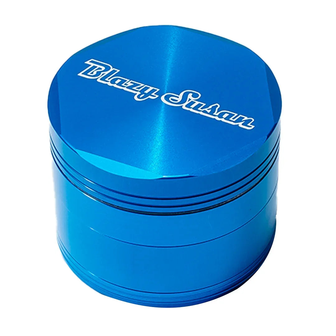 Blue metal herb grinder with Blazy Susan logo on the lid, shown on a white background.
