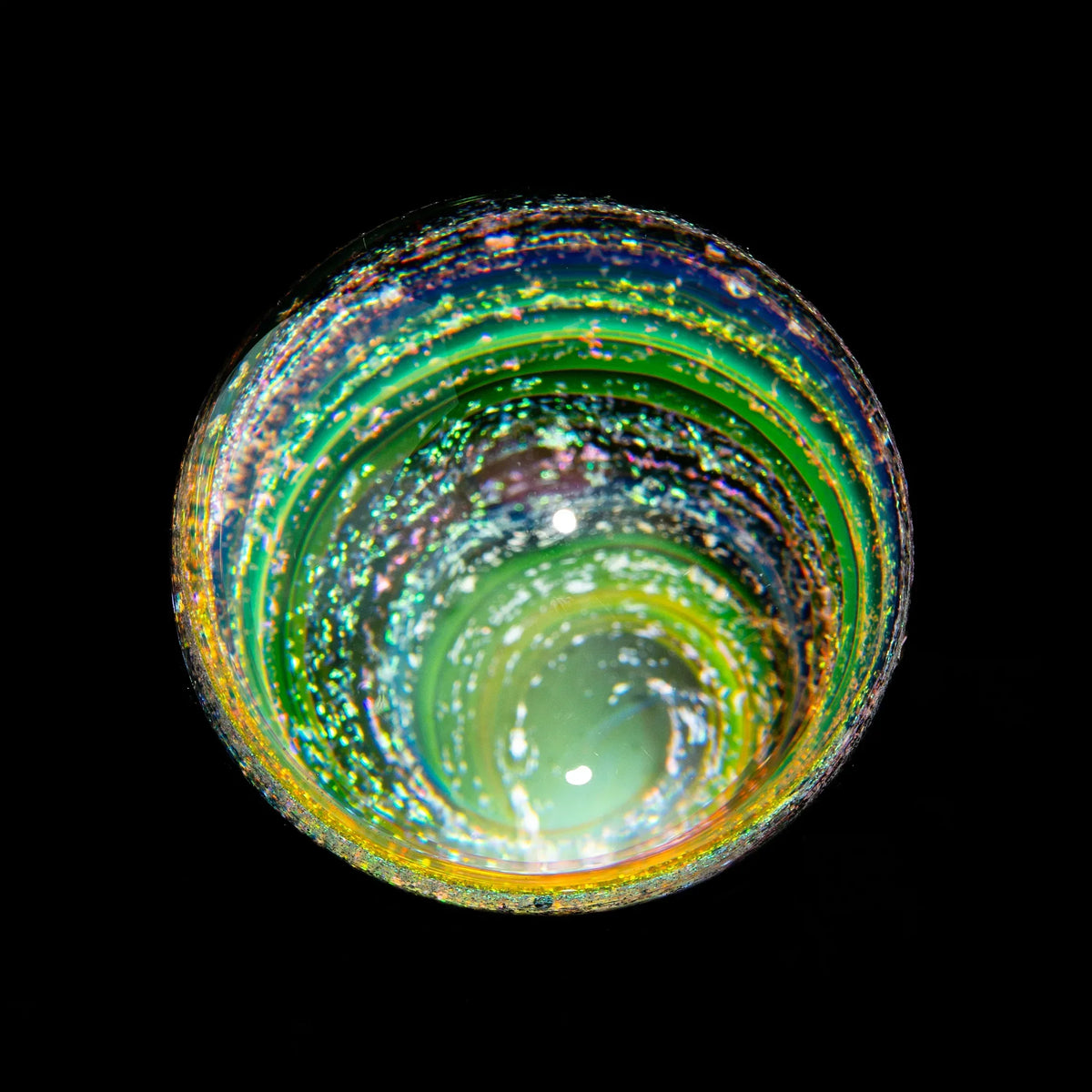 Colorful heady glass pipe bowl with sparkling, iridescent detail against black background