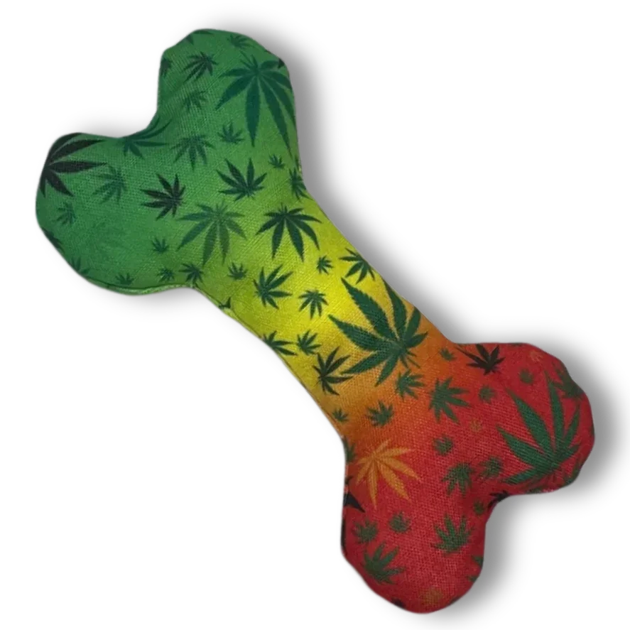 Dog bone toy with rasta gradient colors and leaf pattern on black background