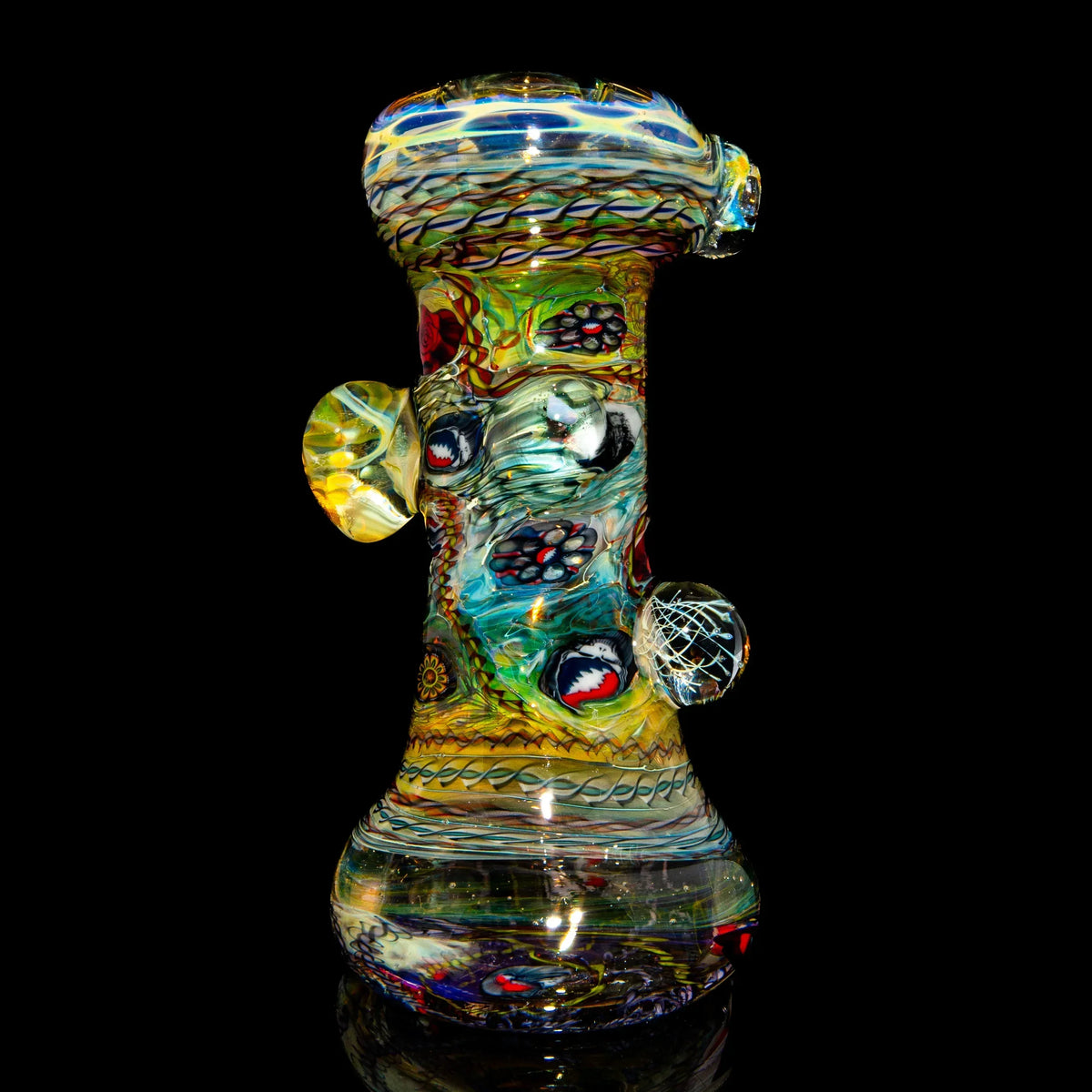 Colorful heady glass water pipe with intricate patterns on a black background